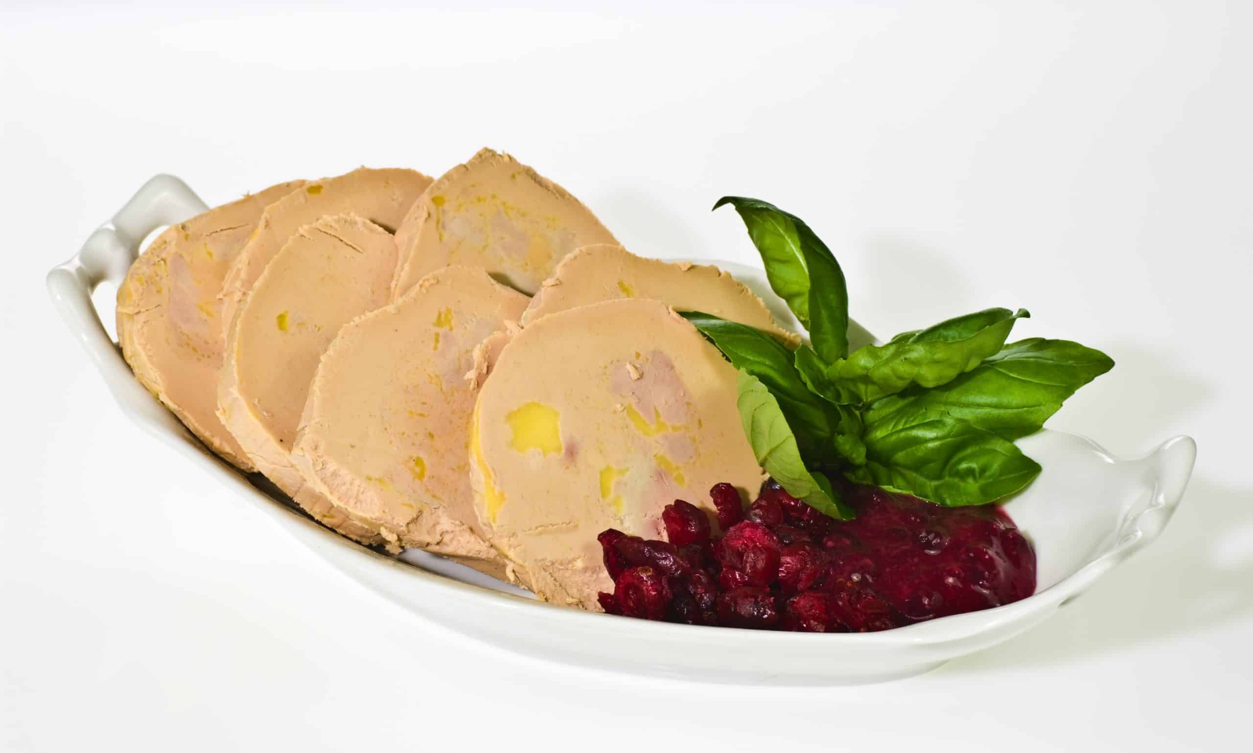Sliced foie gras with cumberland sauce and basil leaves